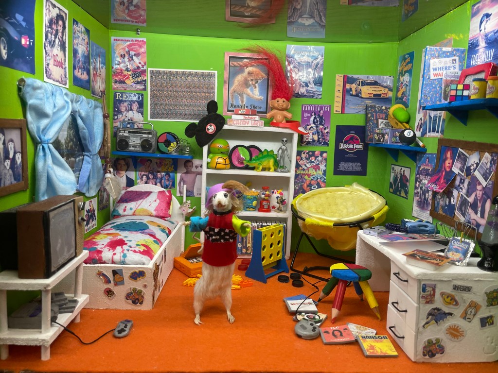 Miniature bedroom scene with taxidermied mouse