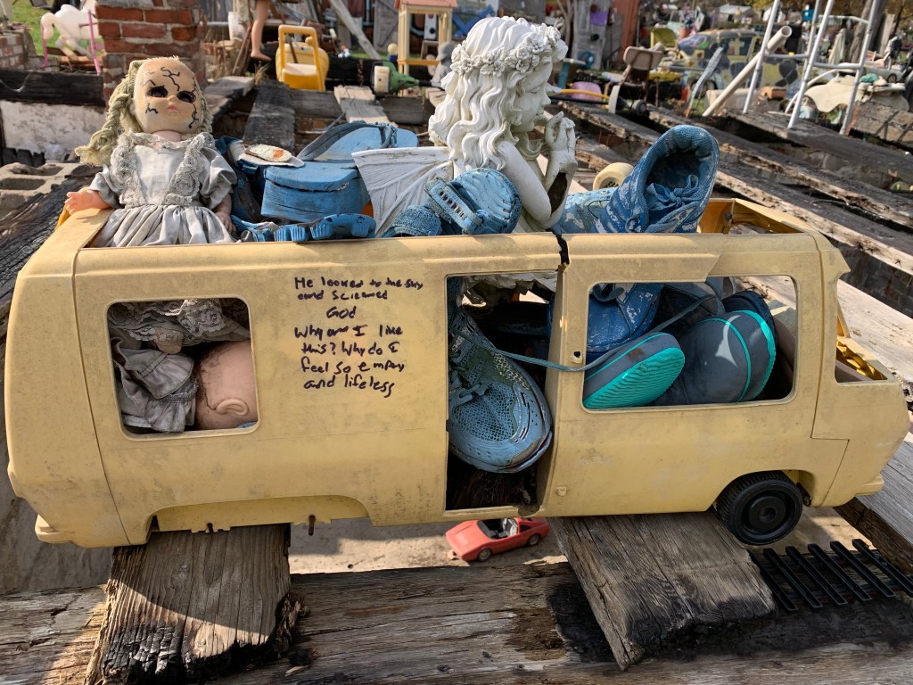 Heidelberg Project exhibit, child's bus full of weathered stuffed animals